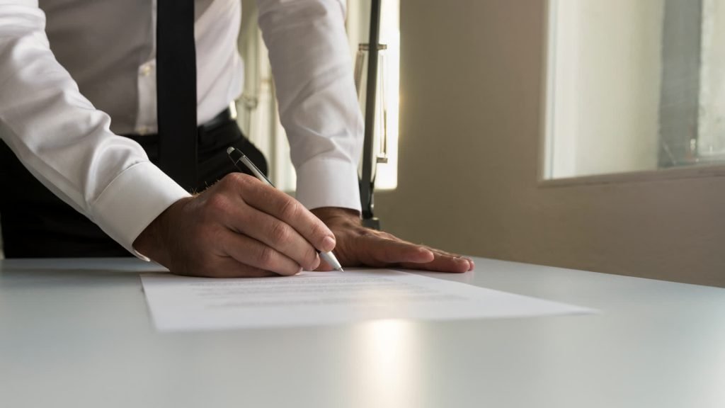 Employer signing an employment contract