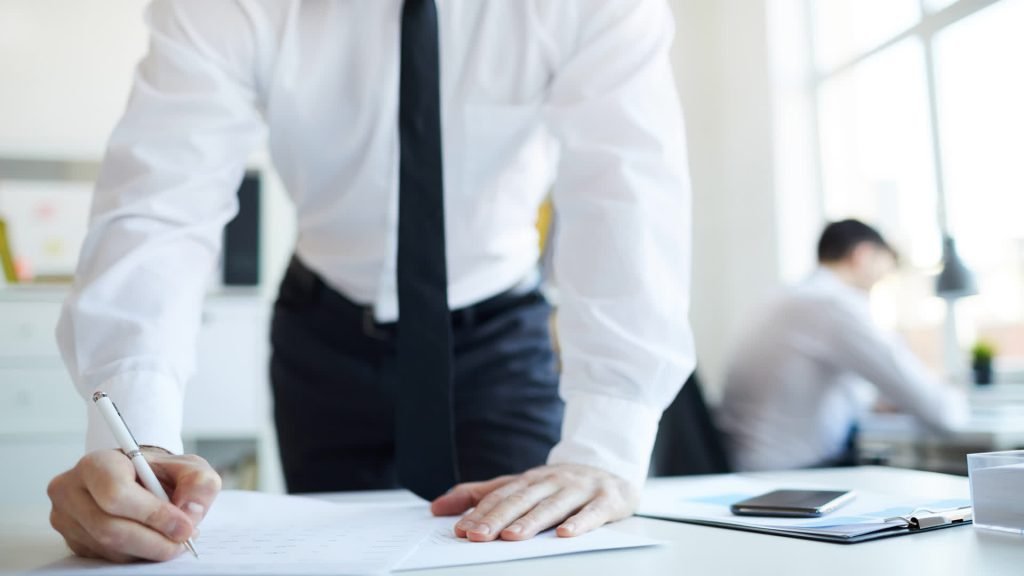 Business people signing an agreement